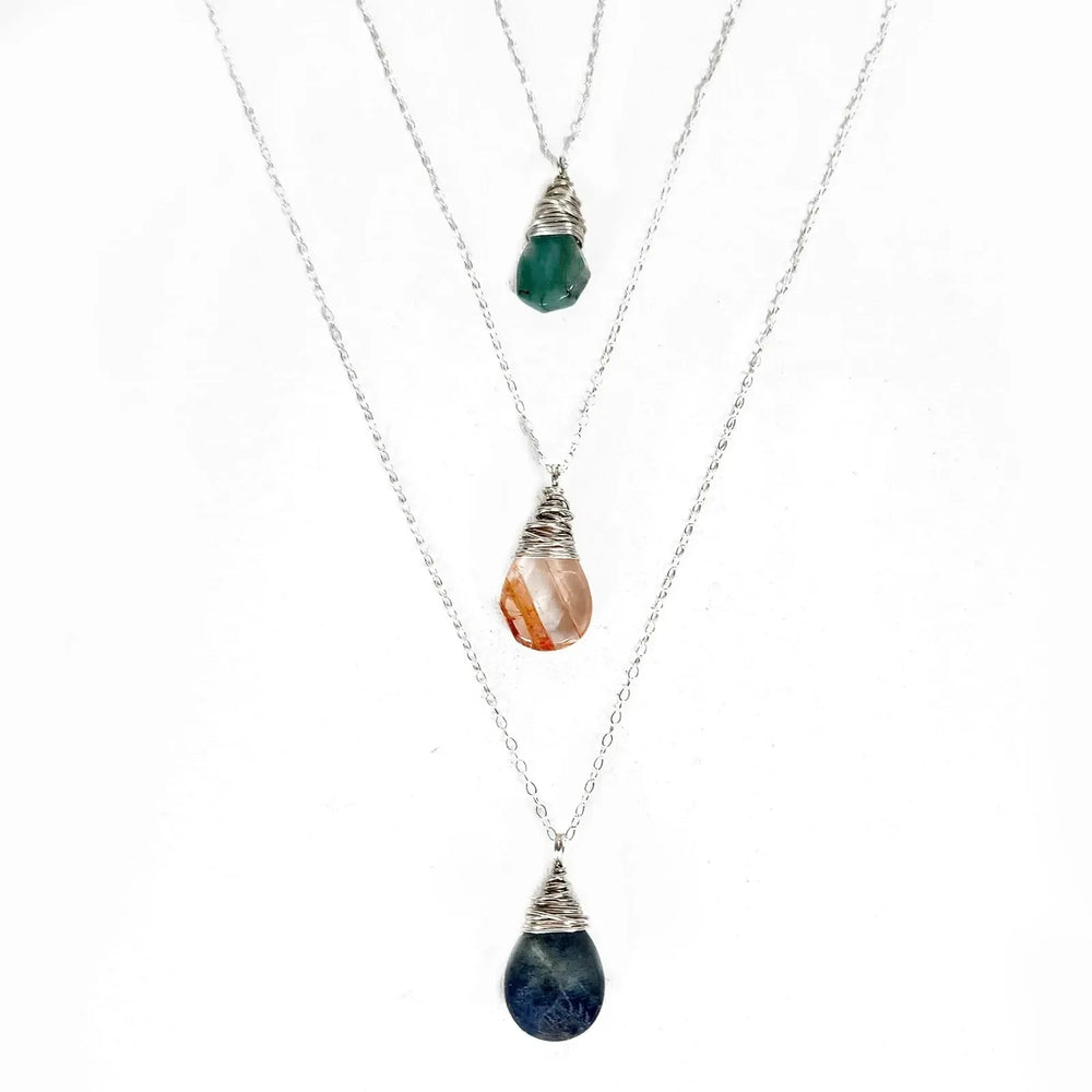 Handmade Sterling silver wire-wrapped Red Quartz, Emerald, and Labradorite gemstone necklaces.