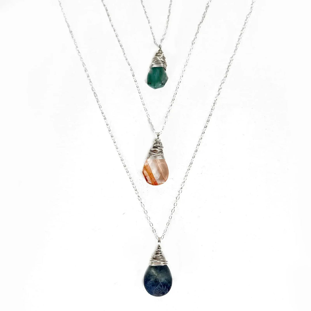 Handmade Sterling silver wire-wrapped Red Quartz, Emerald, and Labradorite gemstone necklaces.