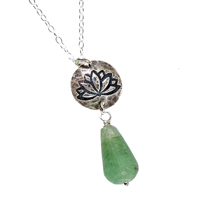 Close-up of silver lotus pendant with green aventurine drop on sterling chain.