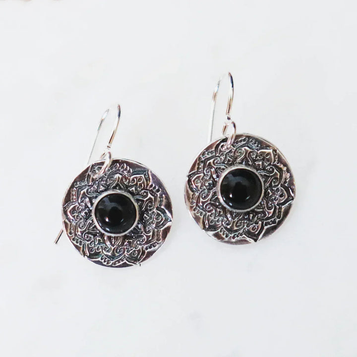 Handmade Silver Mandala Earrings with Black Onyx Healing Crystals on white background.