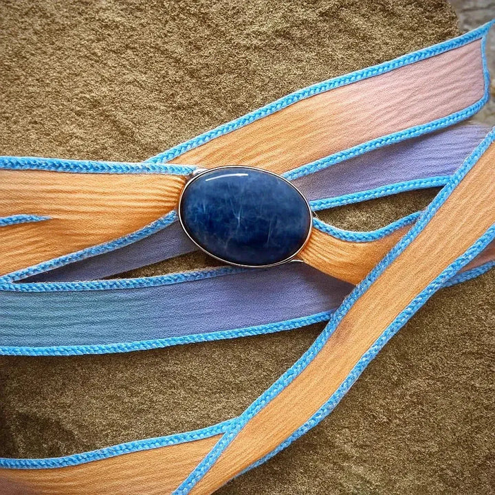 Dyed silk wrap bracelet with sterling silver sodalite setting