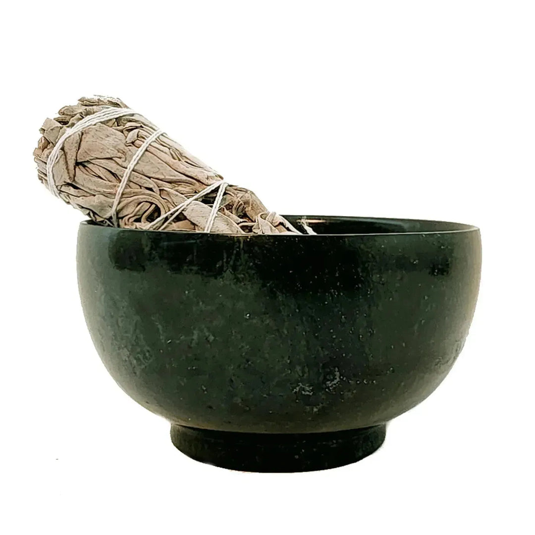 A white sage stick in a stunning green, Hsiuyen Jade Bowl available at Art of the Root.