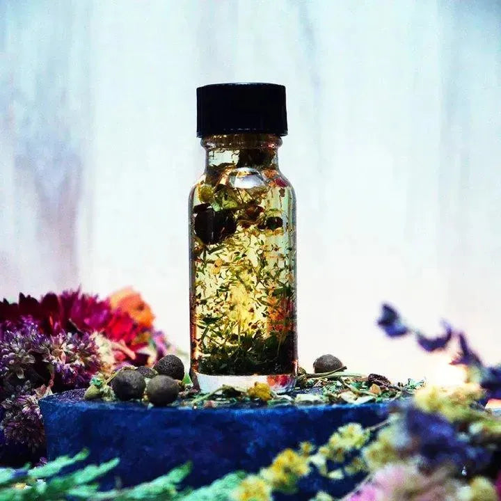 Herbs in a bottle of Money Drawing Oil from Art of the Root. Attract wealth with money oil.