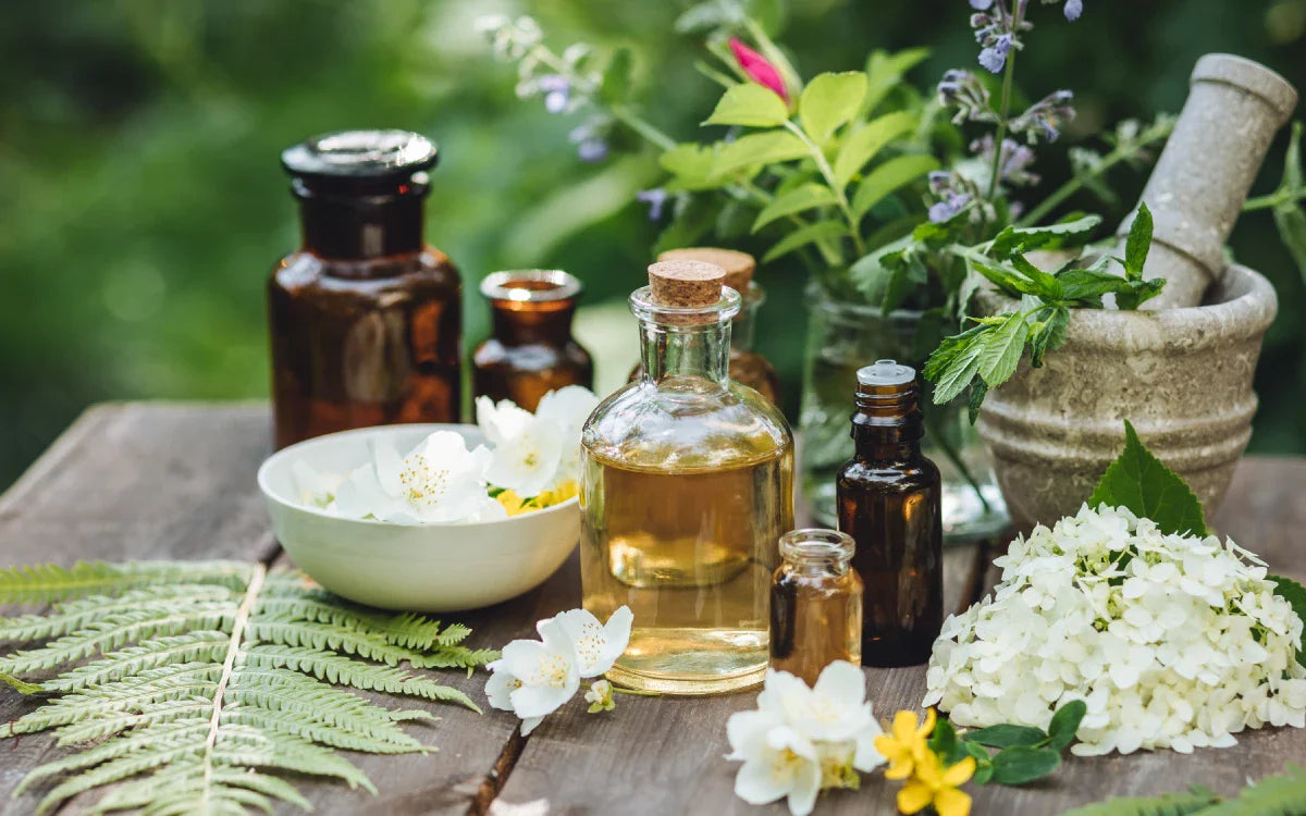 A mortar and pestle and ingredients for creating a perfume for attraction and manifestation.