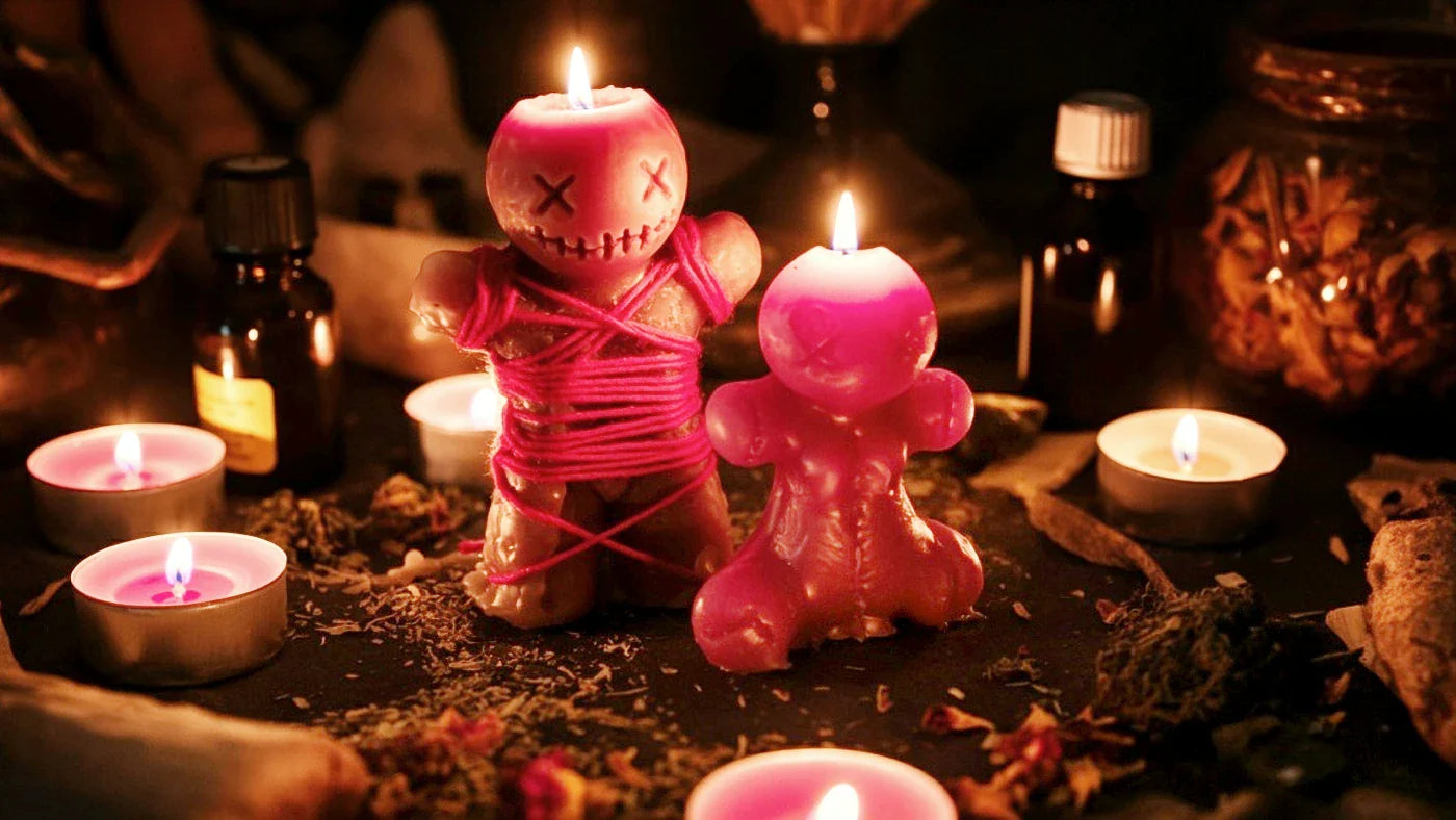 A betrothal Knot Spell being performed on human figure candles. Read about marriage spells here.