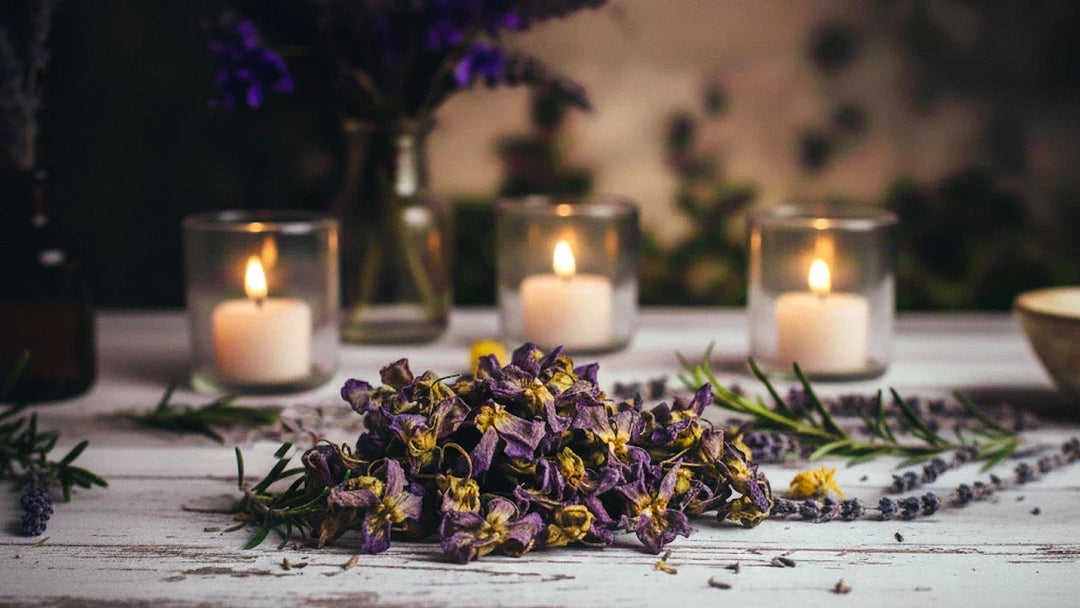 Dried violets on ritual altar with candles for emotional healing and ...