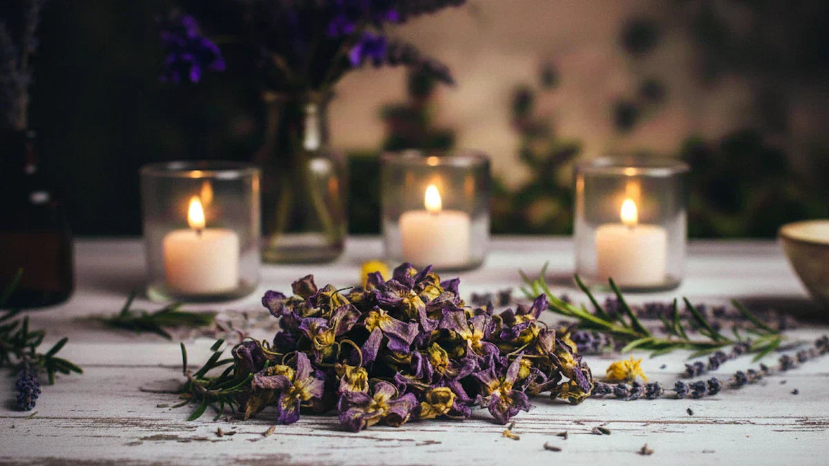 Dried violets on ritual altar with candles for emotional healing and peace spellwork