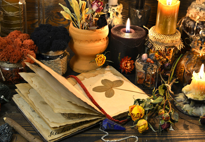 Various witchcraft items like candles and dried flowers. They represent real spells for real witches.