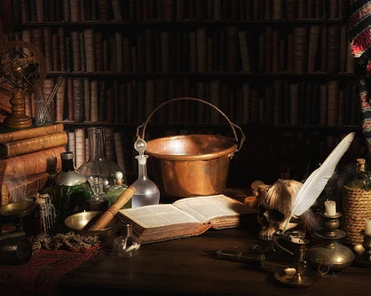 Witchcraft supplies like a book and cauldron. Read about famous with Isobel Gowdie here.