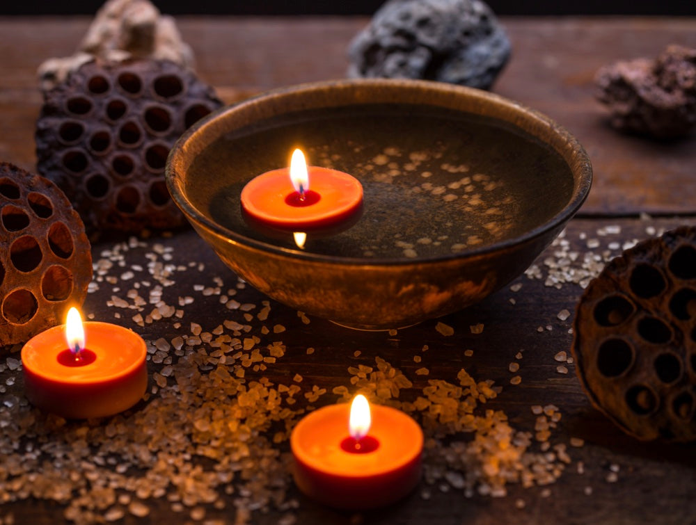 Candles floating in water. Candles are perfect for casting protective spells.