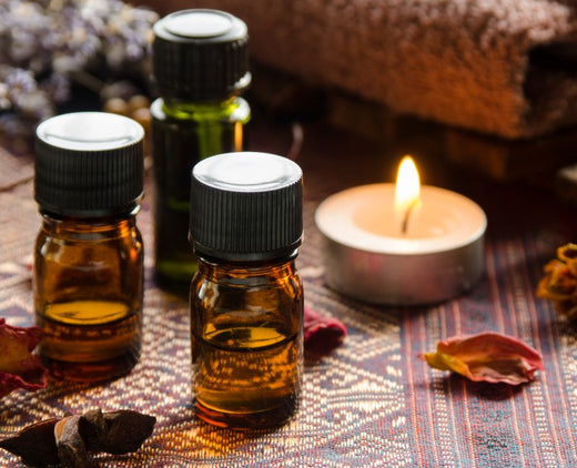 Oils and a candle. Learn how to cleanse your house of negative energy with these items.