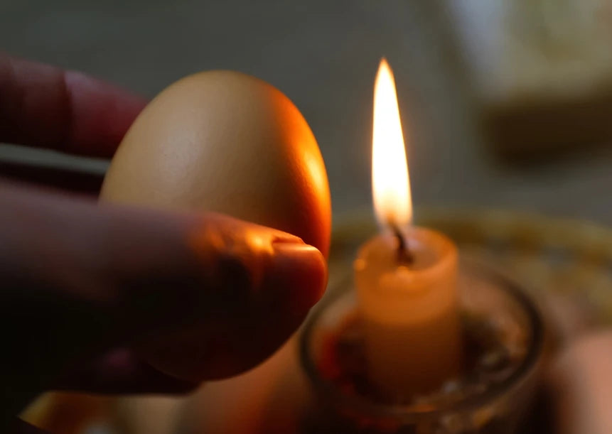 A candle & egg. Read to learn how to do a spiritual egg cleanse & what to say during one.