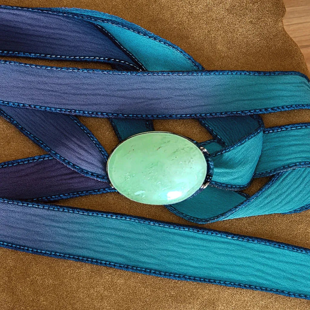 Hand-Dyed Teal Silk Ribbon Bracelet Featuring Green Aventurine Stone on Natural Background.