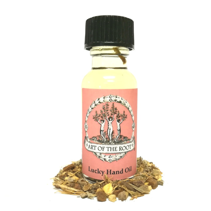 A bottle of Art of the Root's handmade Lucky Hand Oil for luck and prosperity rituals and magick.