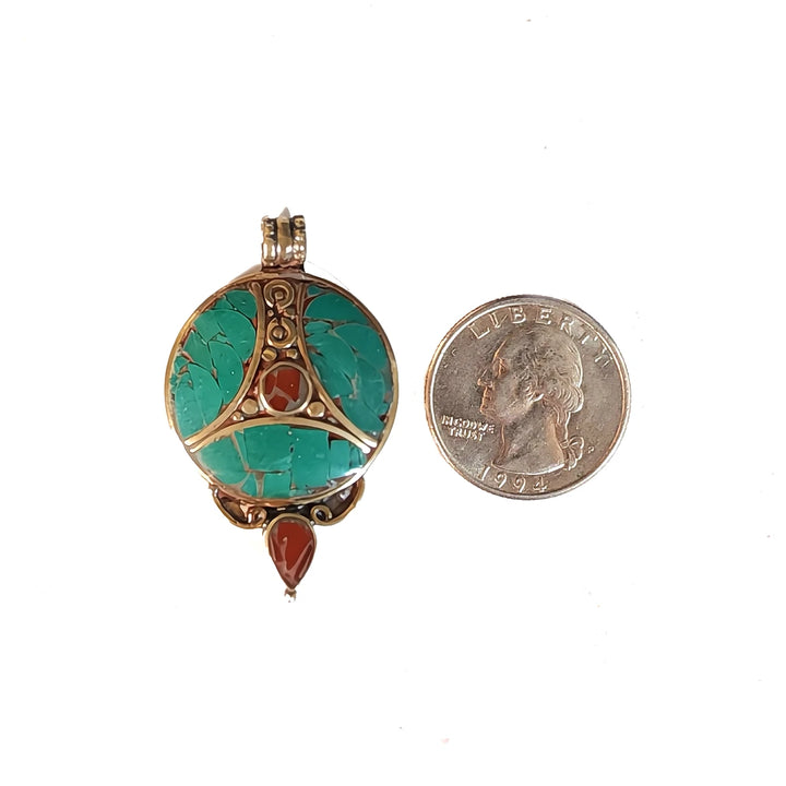 Front of Old Tibetan Trikaya Amulet next to Coin.