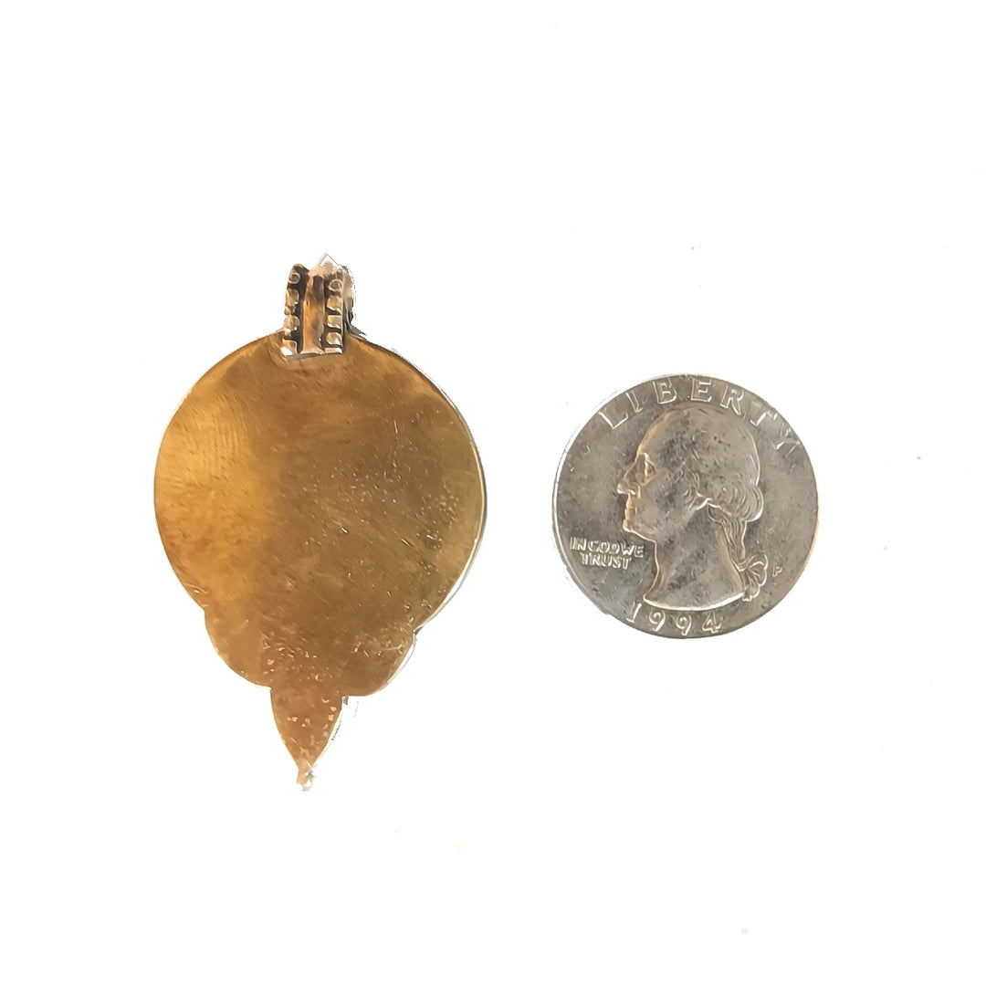 Back of Old Tibetan Trikaya Amulet next to Coin.