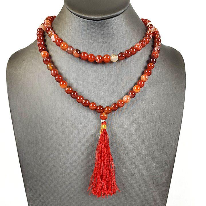A jewelry mannequin wearing Art of the Root Carnelian  Beads for vitality, creativity & passion.