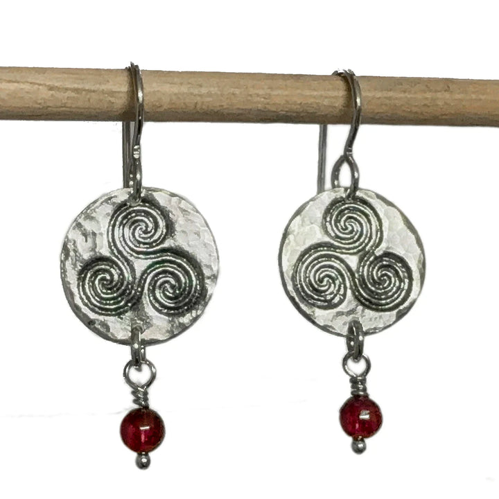 Triskele fine silver earrings with garnet gemstone drop and textured silver disc