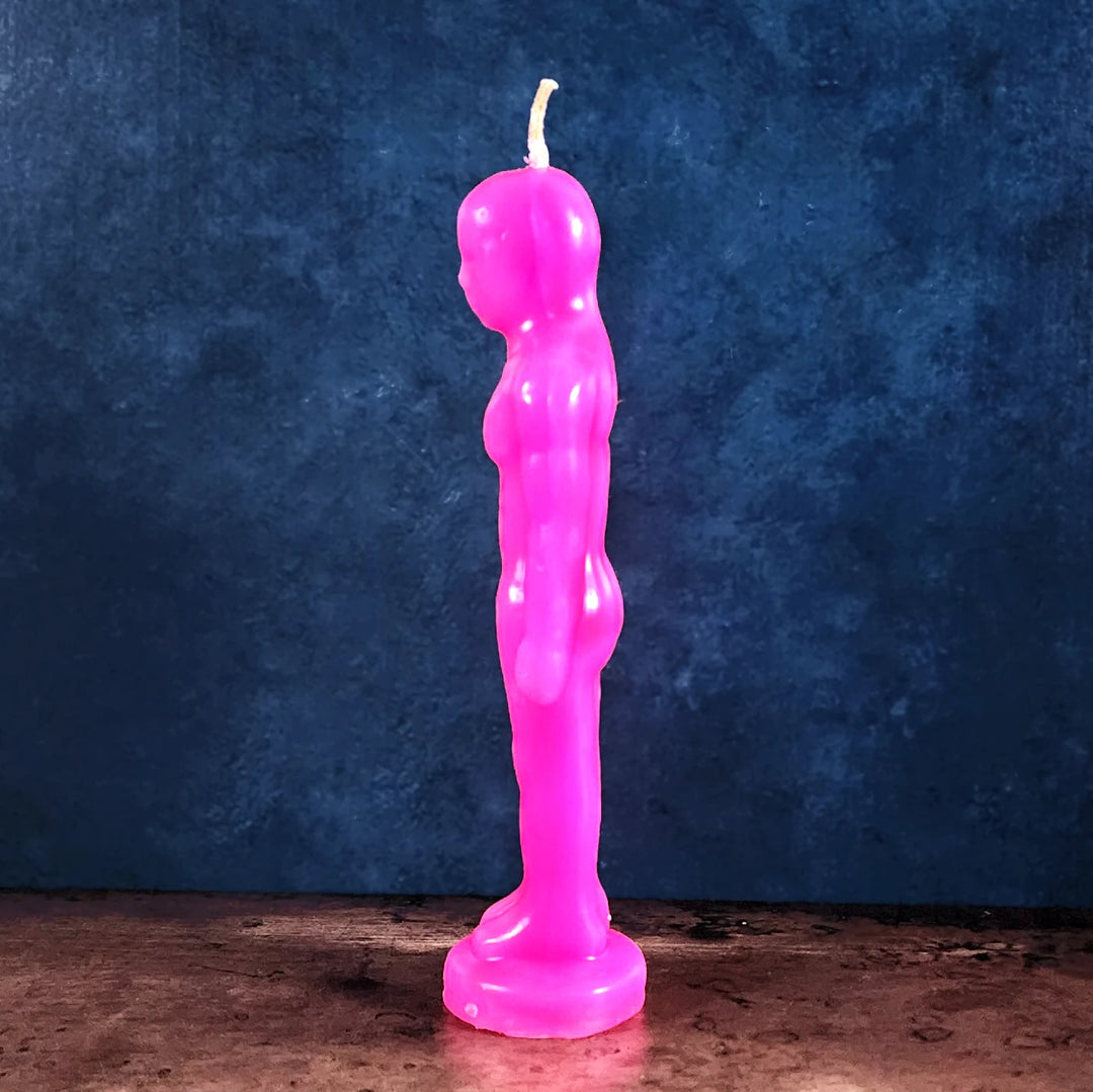 A side view of a pink Man Figure Candle for love & attraction rituals and magick practices