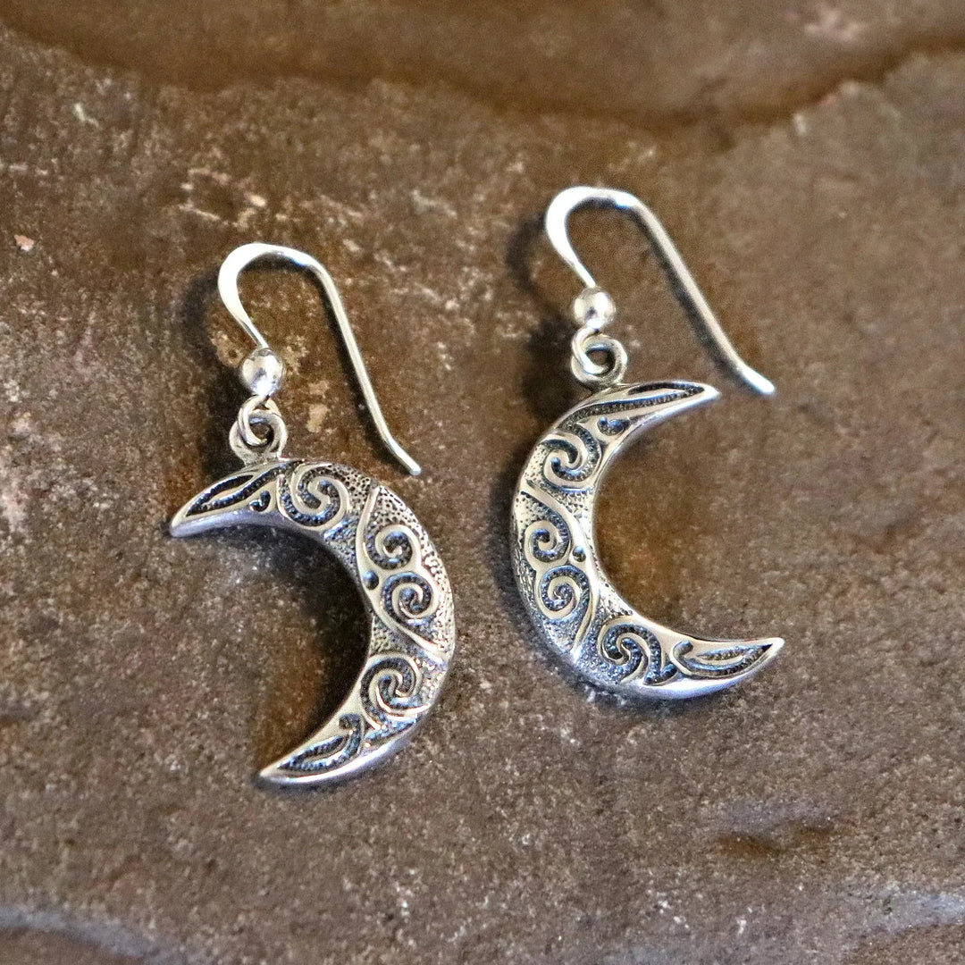Sterling Silv er Crescent Moon Earrings Close Up on Natural Background